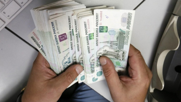 Russia reimposes some capital controls to stem ruble’s slide