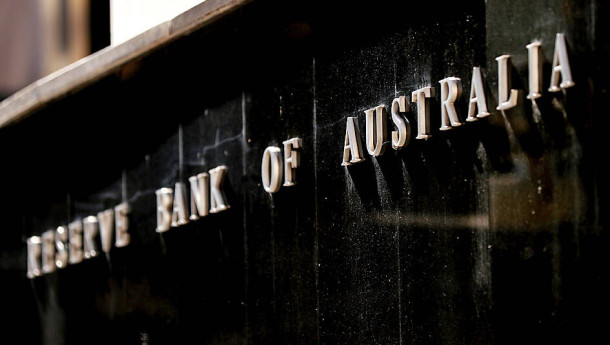 RBA holds key rate to assess economy, sending currency lower