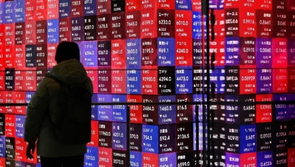 Asian shares tumble as traders brace for global volatility